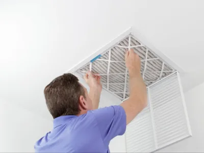 Man changing an air filter